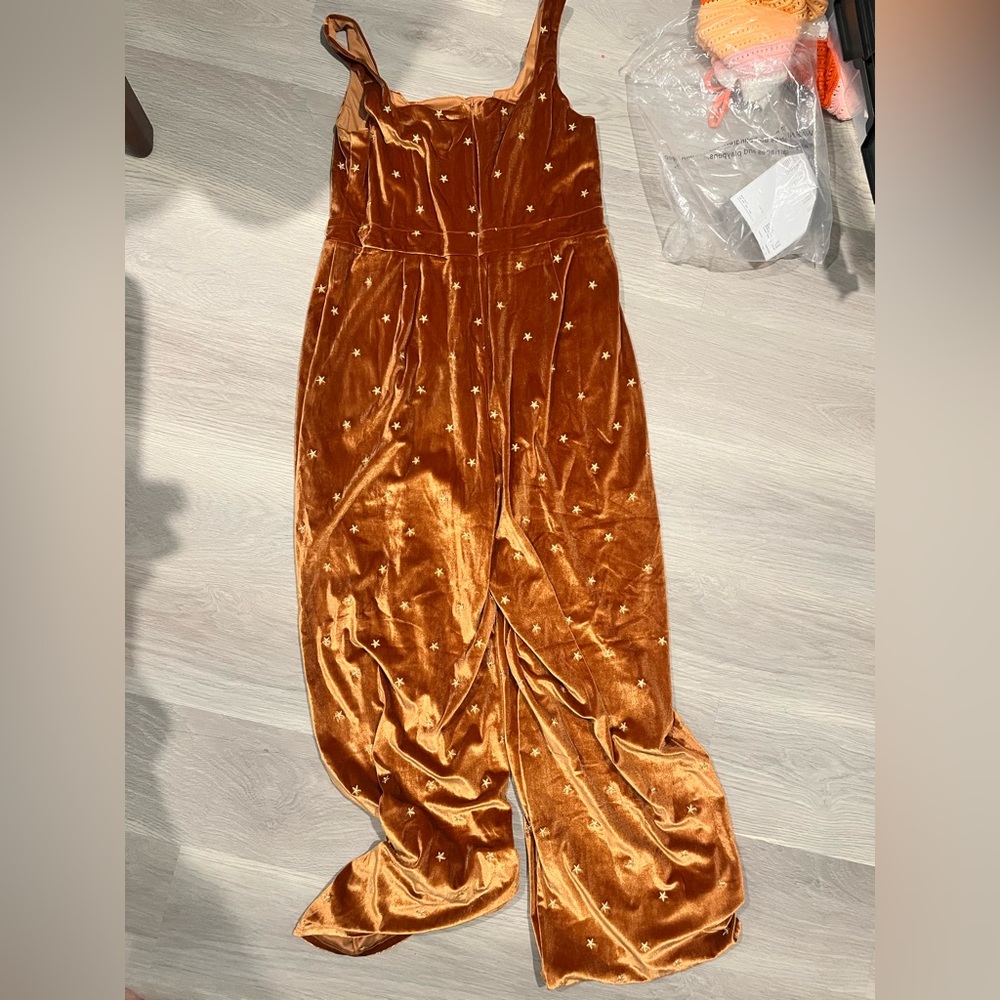 Francesca's Collections Velvet Jumpsuit in Orange with Star Pattern